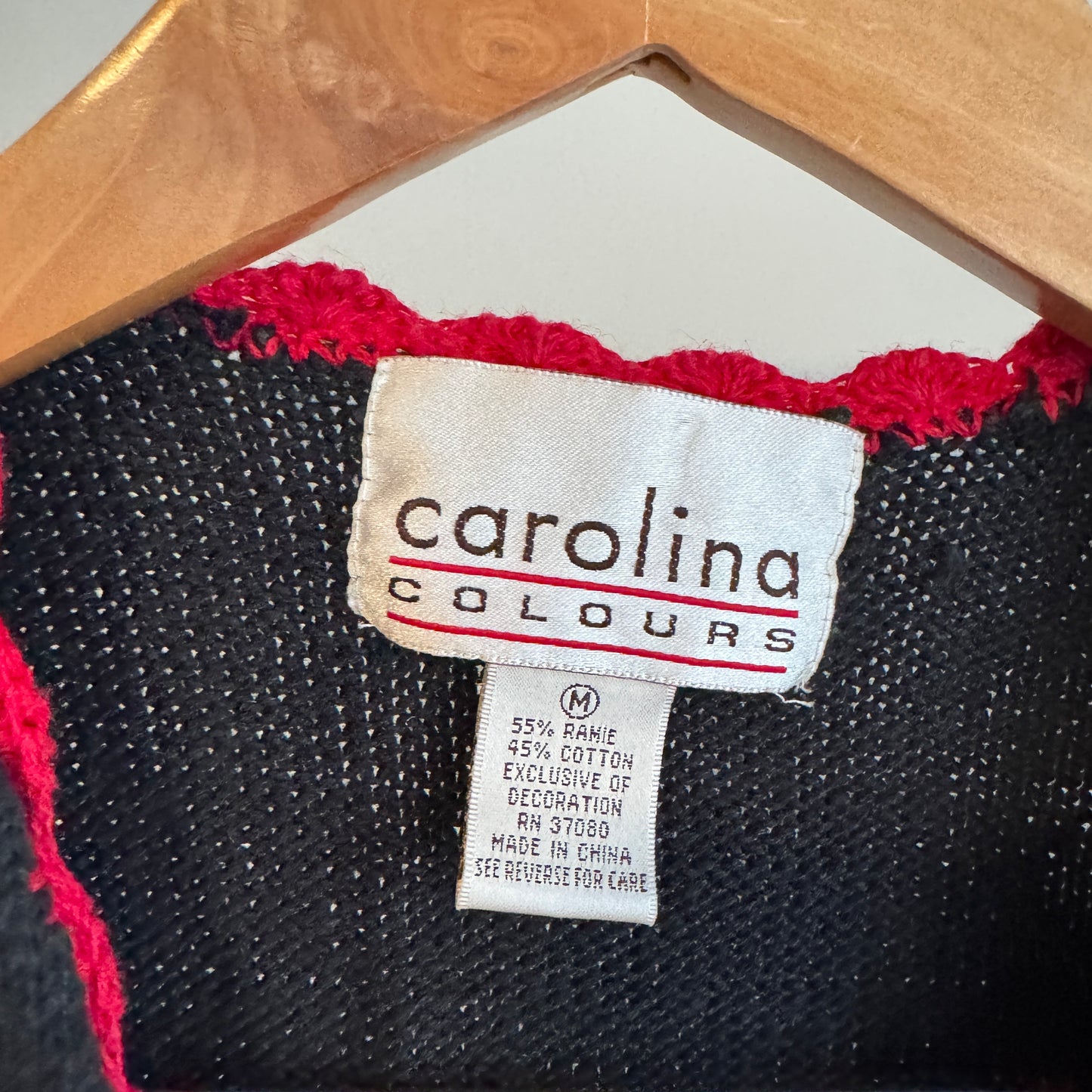 Colorful fall vest with pumpkins apples and scarecrow