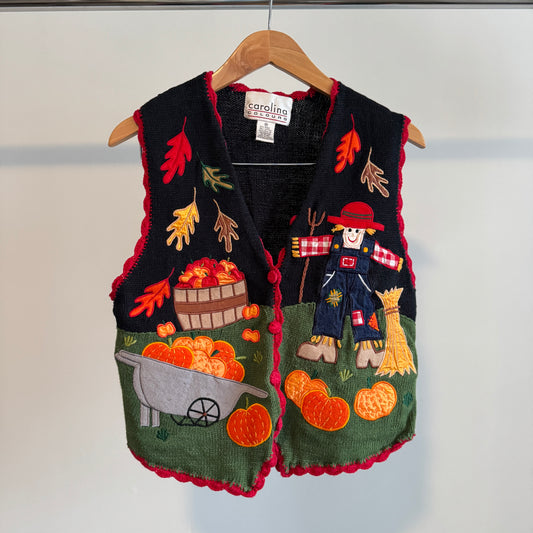 Colorful fall vest with pumpkins apples and scarecrow