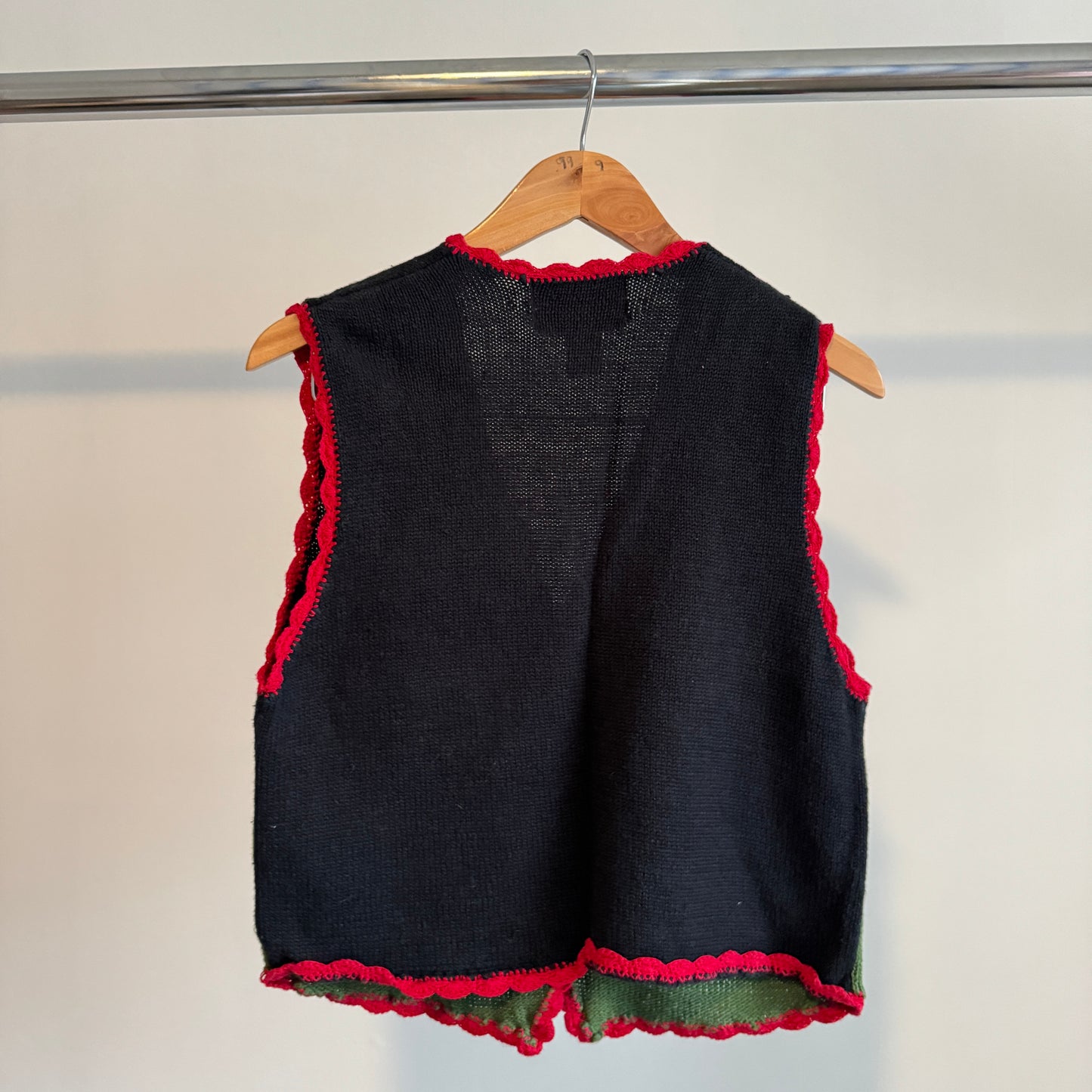 Colorful fall vest with pumpkins apples and scarecrow